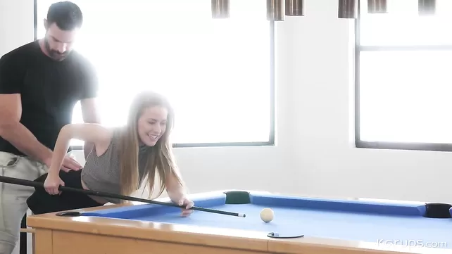 The girl lay down on the billiard table and gave a friend a pussy