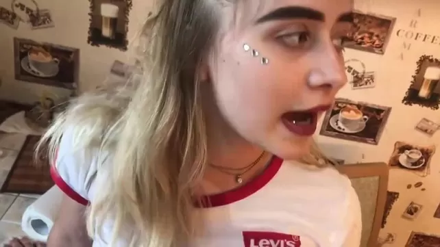 Girlfriend with piercings and in a T-shirt is ready for sex
