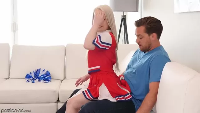 A petite cheerleader rubs against a guy's penis and jumps on it