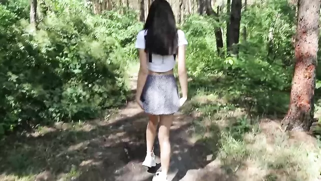 Pretty woman sucks boyfriend's dick in the woods and catches cum with her mouth